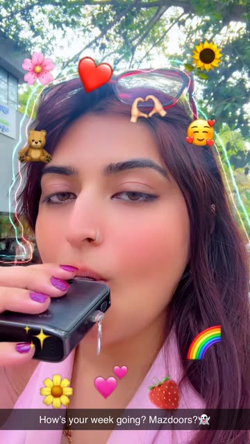 Neman Seher's Vibrant Outdoor Moment with Vape and Digital